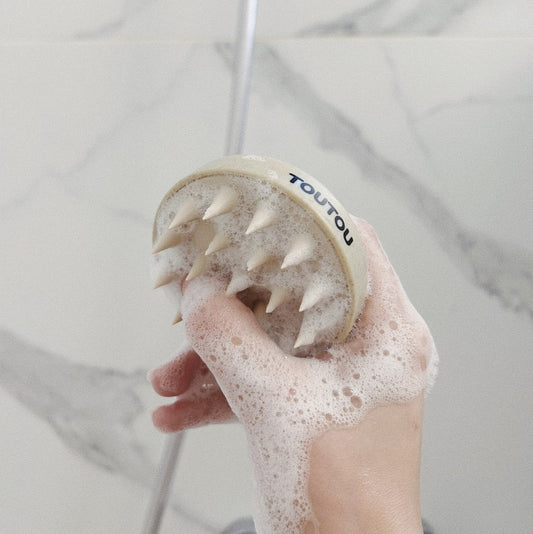 Brosse en silicone pour le bain